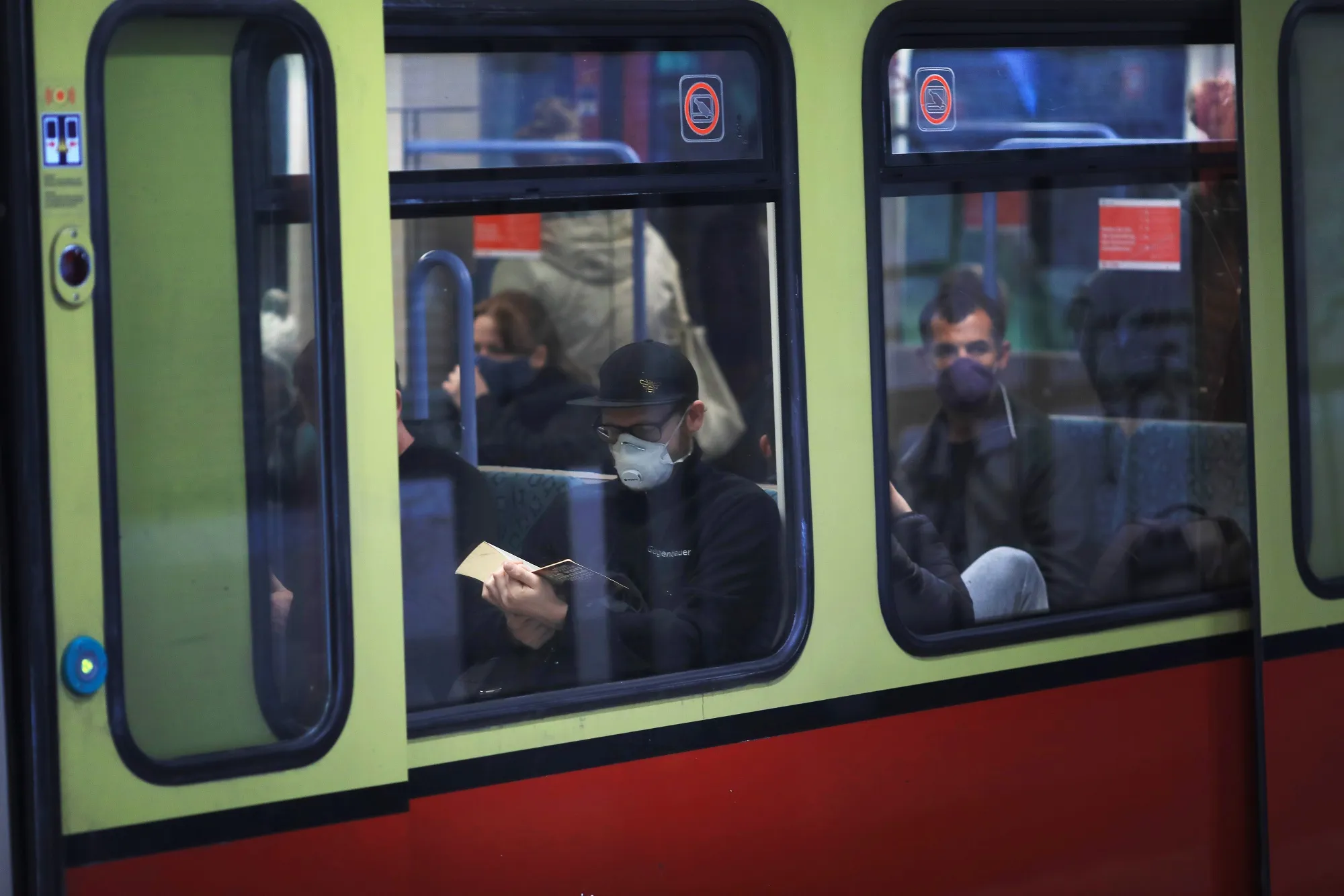 Commuters sit on board an S-Bahn train at Shoenauer Alle station in Berlin.