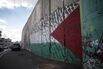 A Palestinian flag graffiti mural sits on a section of the Israeli West Bank security barrier wall&nbsp;on Friday, Dec.. 15, 2017.&nbsp;