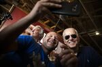 Joe Biden takes a selfie with an attendee at the Iowa State Fair, Aug. 8.