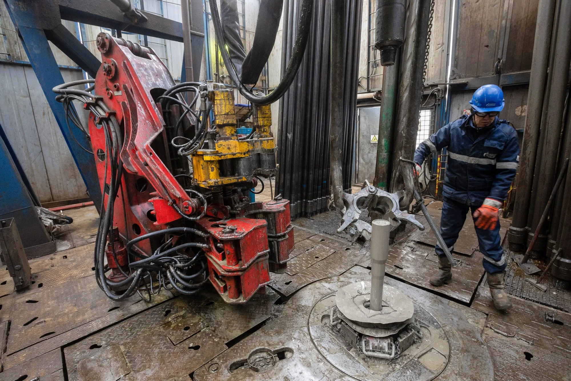 A worker monitors drilling procedures at a gas drilling rig in the Sakha Republic, Russia.
