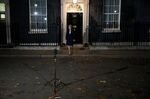 Theresa May, U.K. prime minister, walks out to deliver a statement in London.