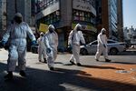 South Korean soldier spray a street in the Gangnam district of Seoul, March 5.