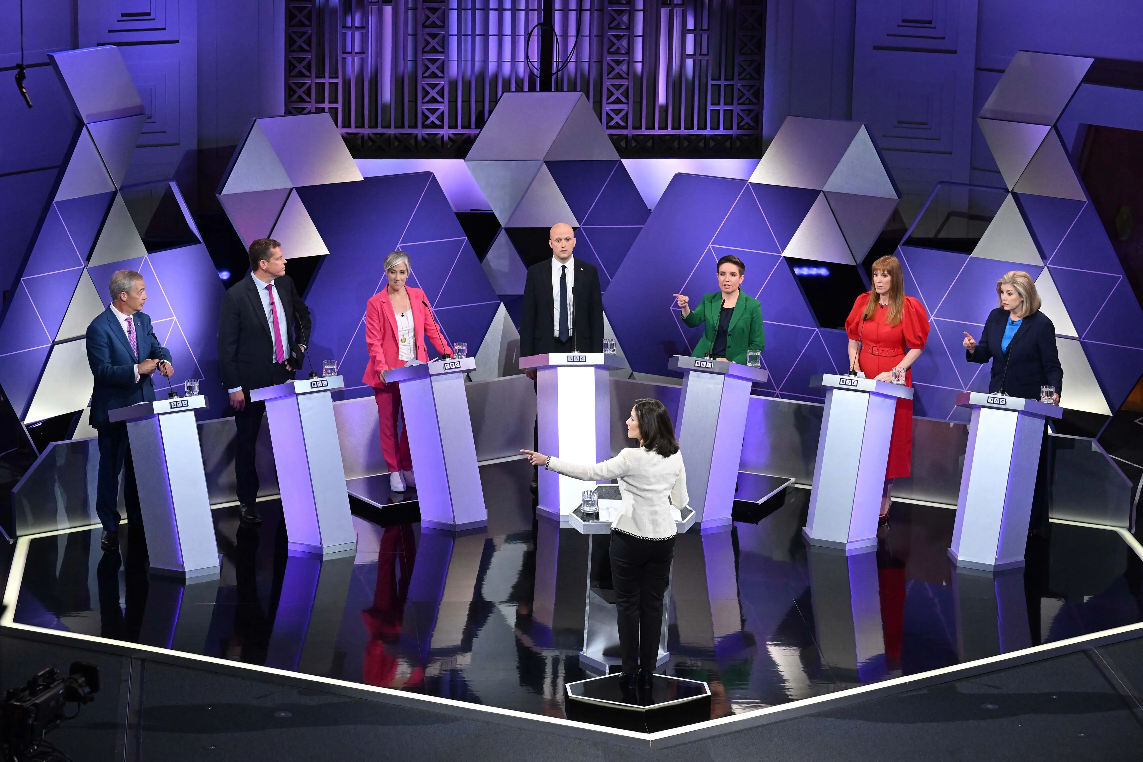 Reform UK leader Nigel Farage, from left, Rhun ap Iorwerth, Daisy Cooper, Stephen Flynn, Carla Denyer, Angela Rayner and Penny Mordaunt during in the BBC Election Debate hosted by BBC news presenter Mishal Husain (front), at London on June 7.