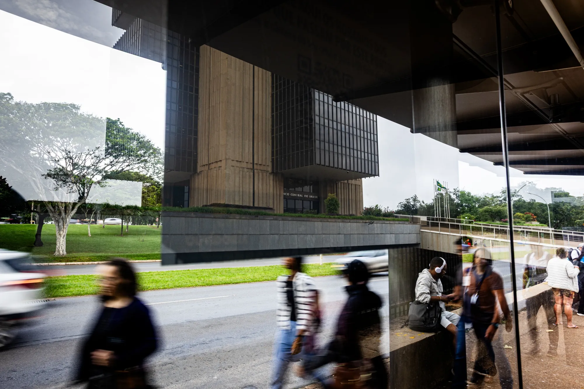 Commuters pass the Central Bank of Brazil in Brasilia.