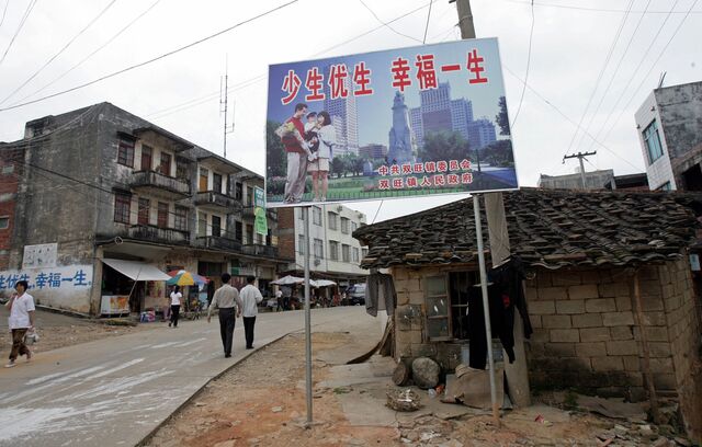 A billboard for China’s “one-child” policy in the Guangxi region in 2007 reads: “Have less children, have a better life.”