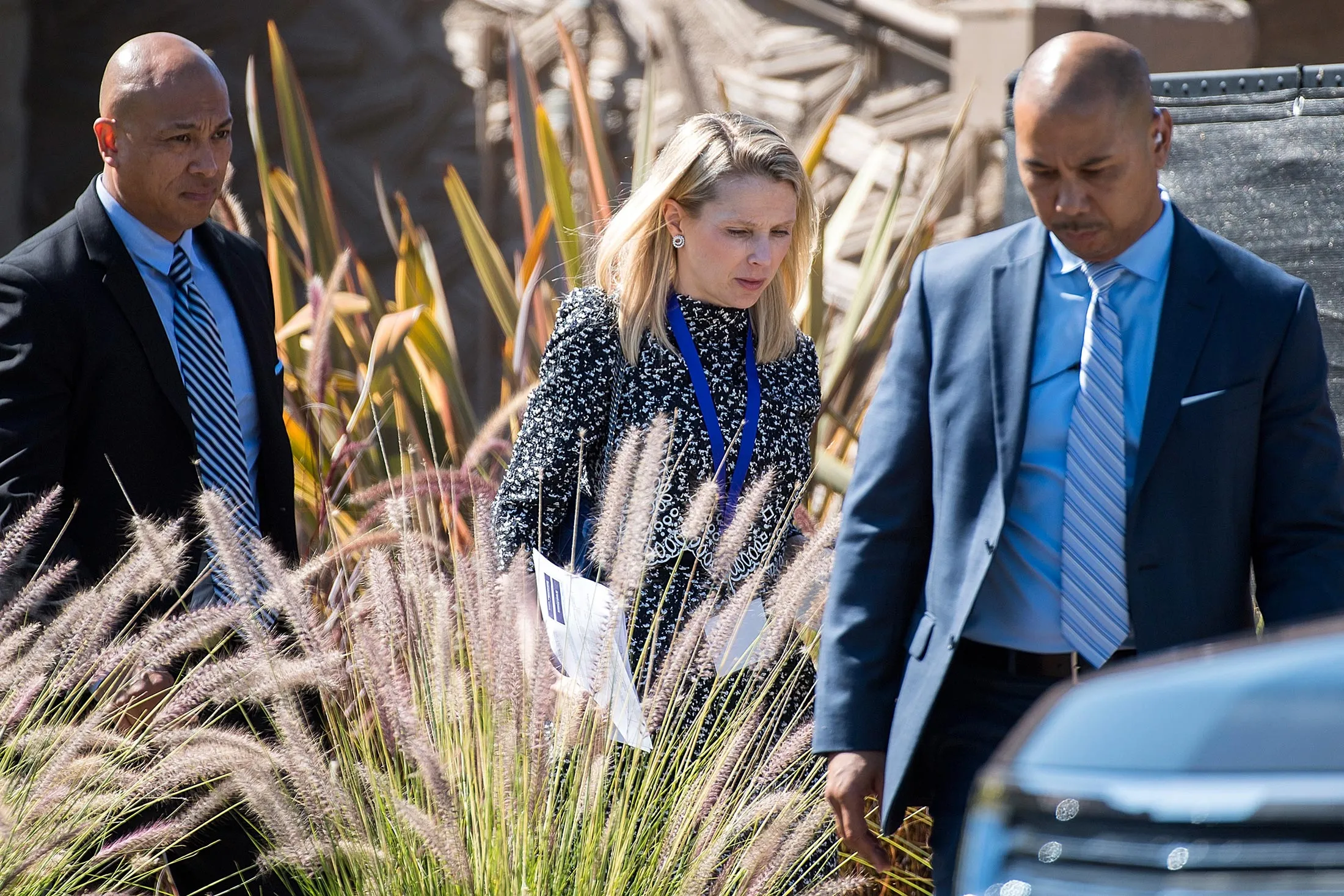 Marissa Mayer, president and chief executive officer of Yahoo! Inc., center, leaves the company's annual shareholders meeting in Santa Clara, Calif. on June 30, 2016.
