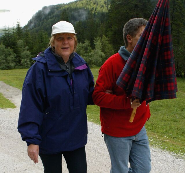 German Chancellor Angela Merkel and her husband Joachim Sauer go for a walk on August 3, 2006 in Sexten, Italy. Merkel and Sauer are currently spending their holiday at the Alte Post hotel in the small town of Sexten in the Dolomite Alps, South Tyrol.