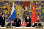  Xi (standing, right center) and Putin (left center) at the signing ceremony in Shanghai with Gazprom's Miller (seated, left) and  CNPC Chairman Zhou Jiping (seated, right)