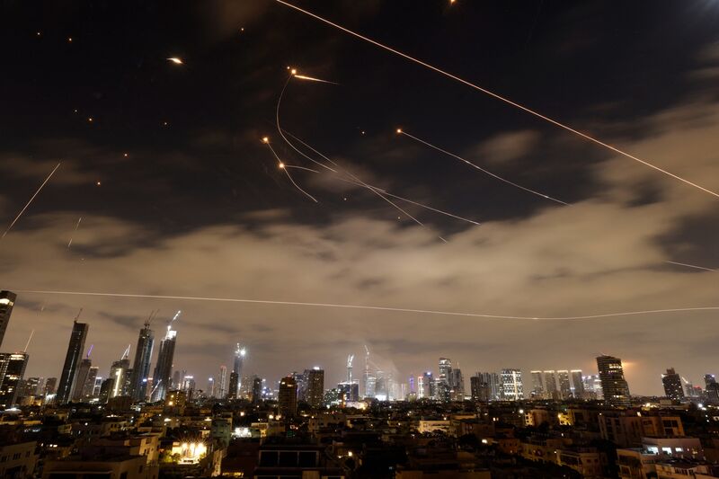 Israeli air defense systems intercept Iranian missiles over Tel Aviv on June 16.