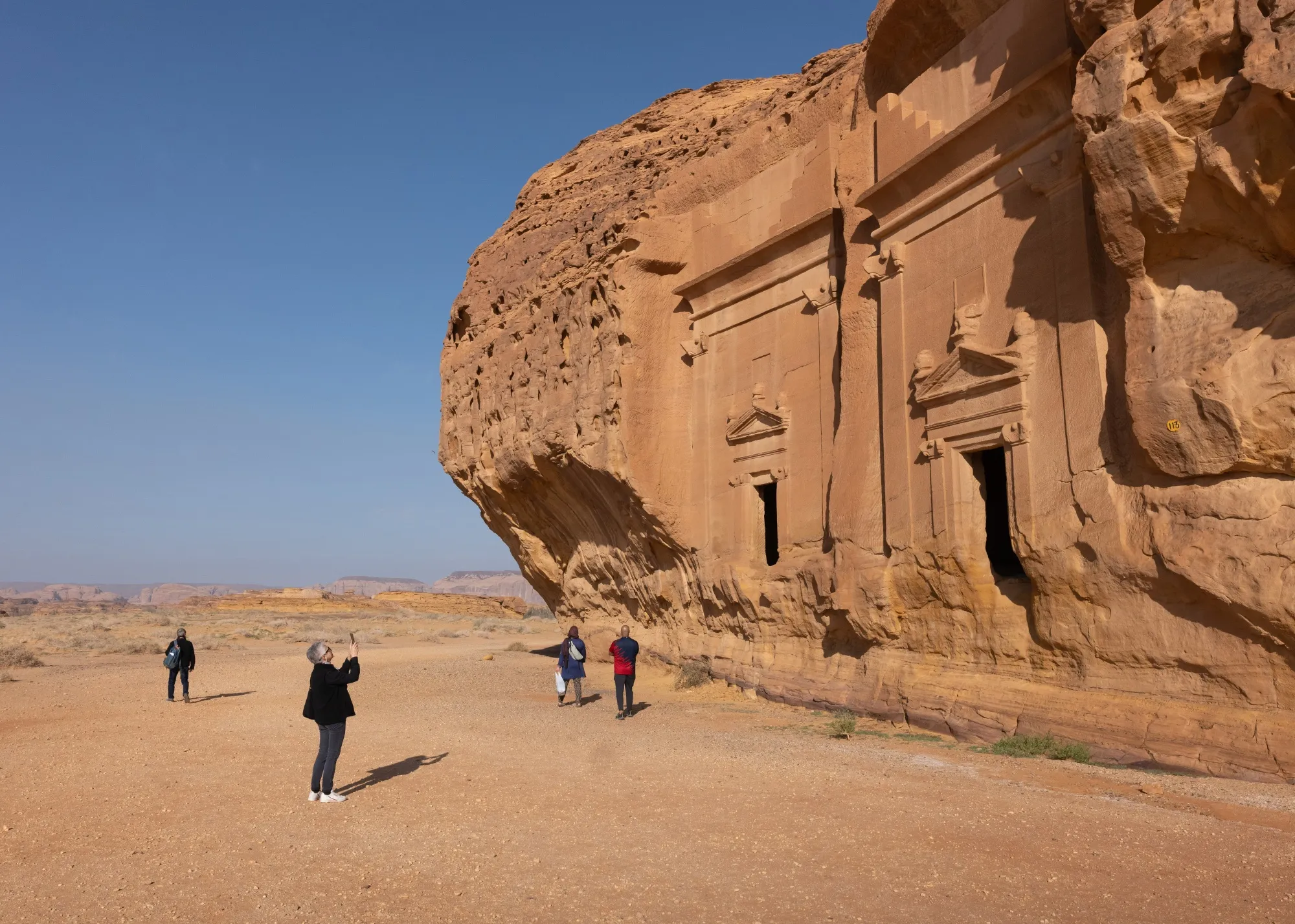 Tourists during a visit to the ancient archaeological site of Hegra in AlUla, Saudi Arabia, in January.