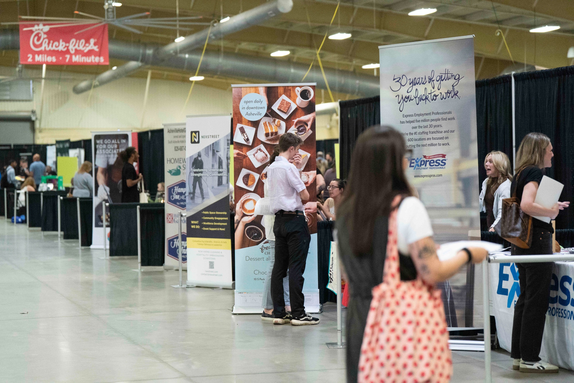 Jobseekers speak with recruiters during a job fair in Fletcher, North Carolina.