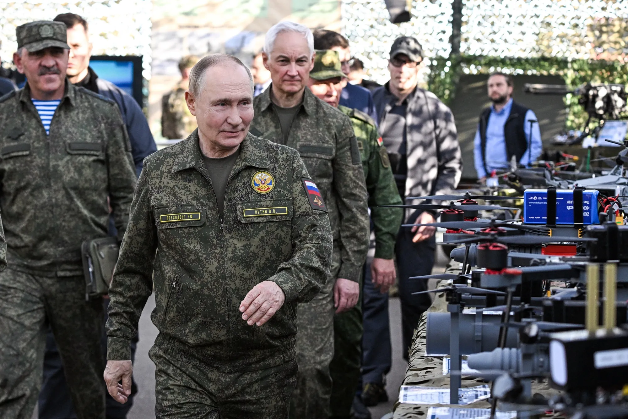 Vladimir Putin tours an exhibition of military equipment.&nbsp;