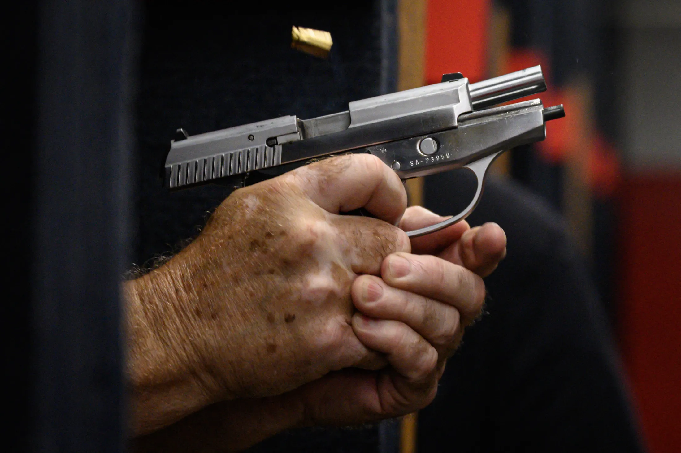 A person fires a pistol at a gun&nbsp;range in New York on June 23.