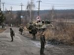 Ukrainian servicemen northwest of Kyiv on Feb. 24. 