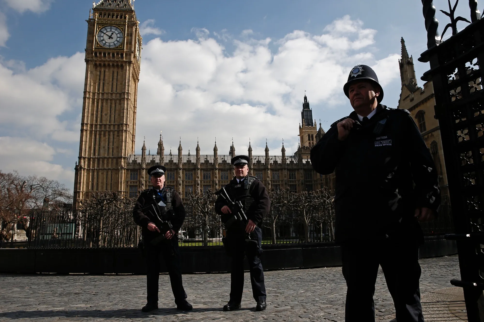 Armed British police officers guard the Big Ben following a series of explosions in Brussels.

