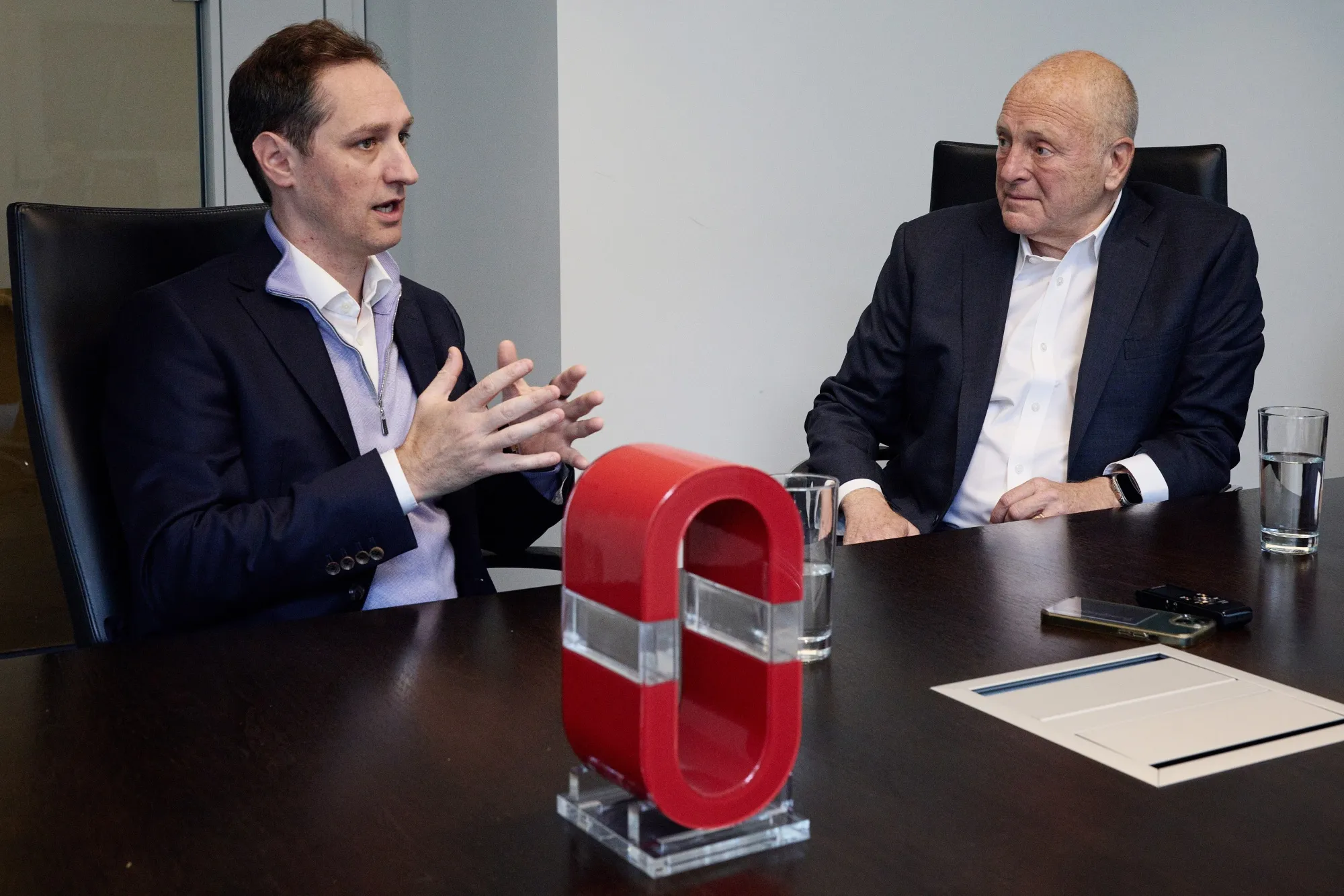Olivier Desmarais, left, and Bruce Heyman speak at Power Sustainable’s office in Montreal.