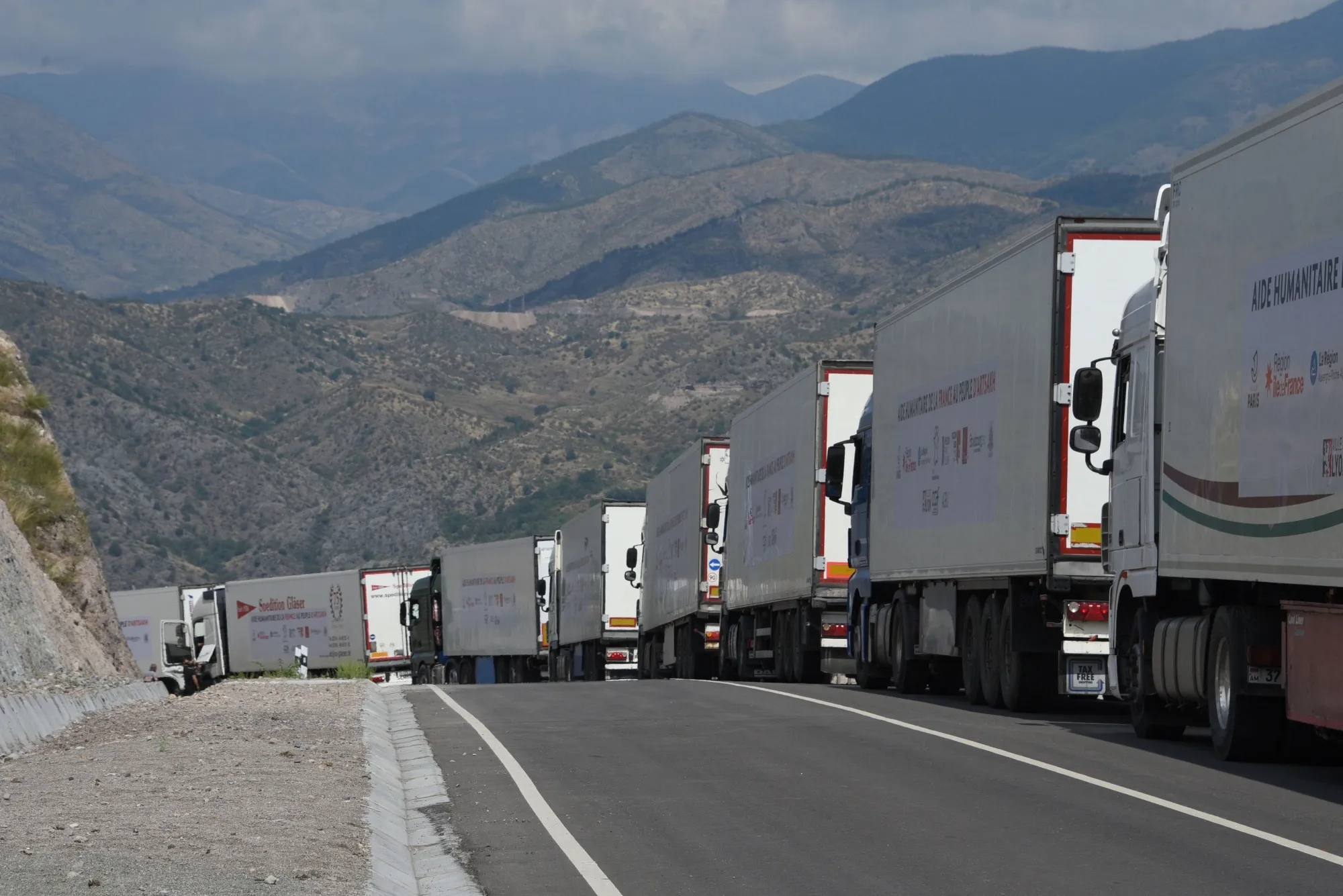 Trucks carrying humanitarian aid bound for the Nagorno-Karabakh region line up at the entrance to the Lachin corridor on Aug. 30.