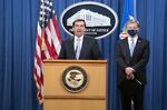 John Demers speaks during a Department of Justice news conference with Christopher Wray on Oct. 28.