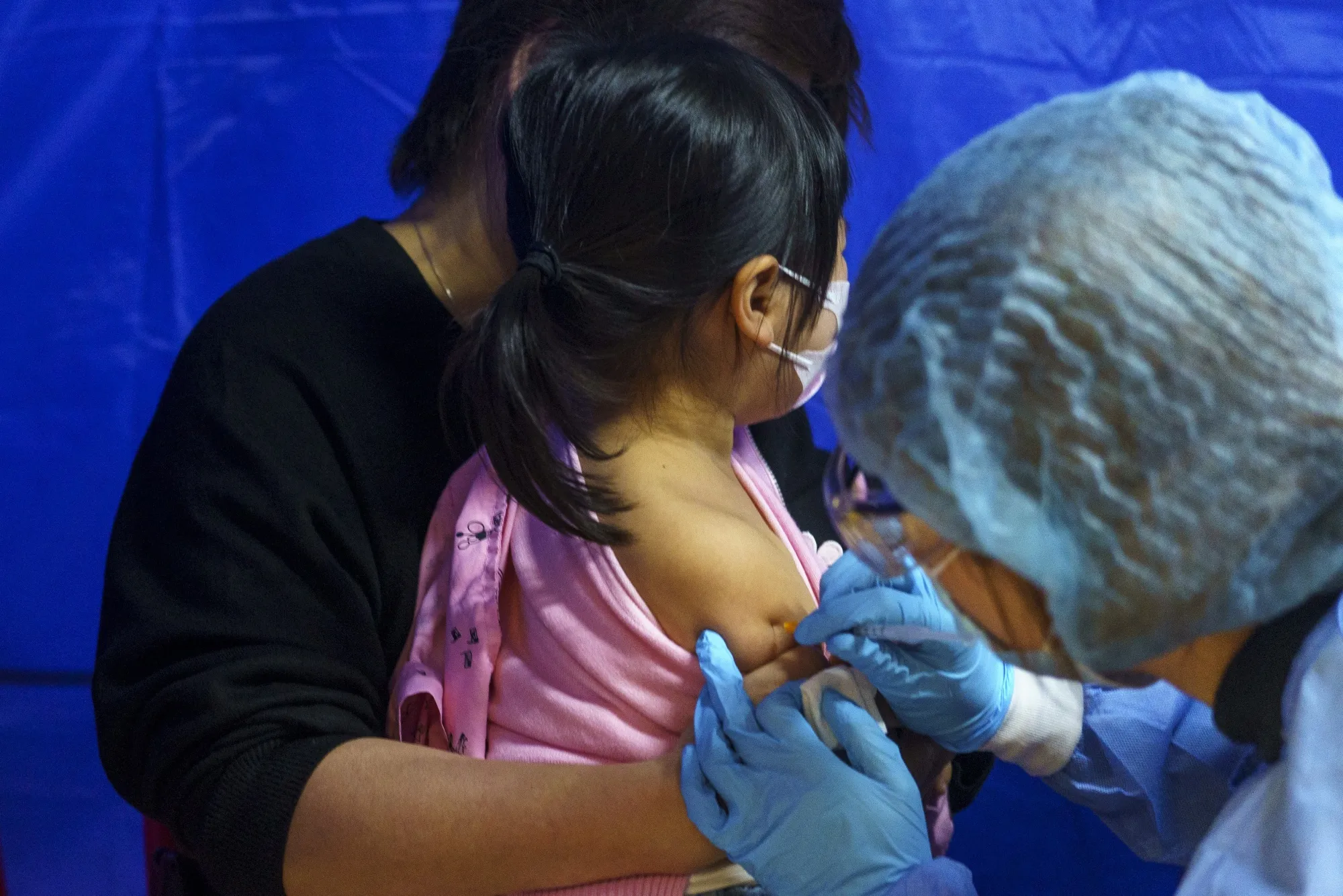 A child receives a dose of the SinovacBiotech Ltd. Covid-19 vaccine&nbsp;in Hong Kong.&nbsp;