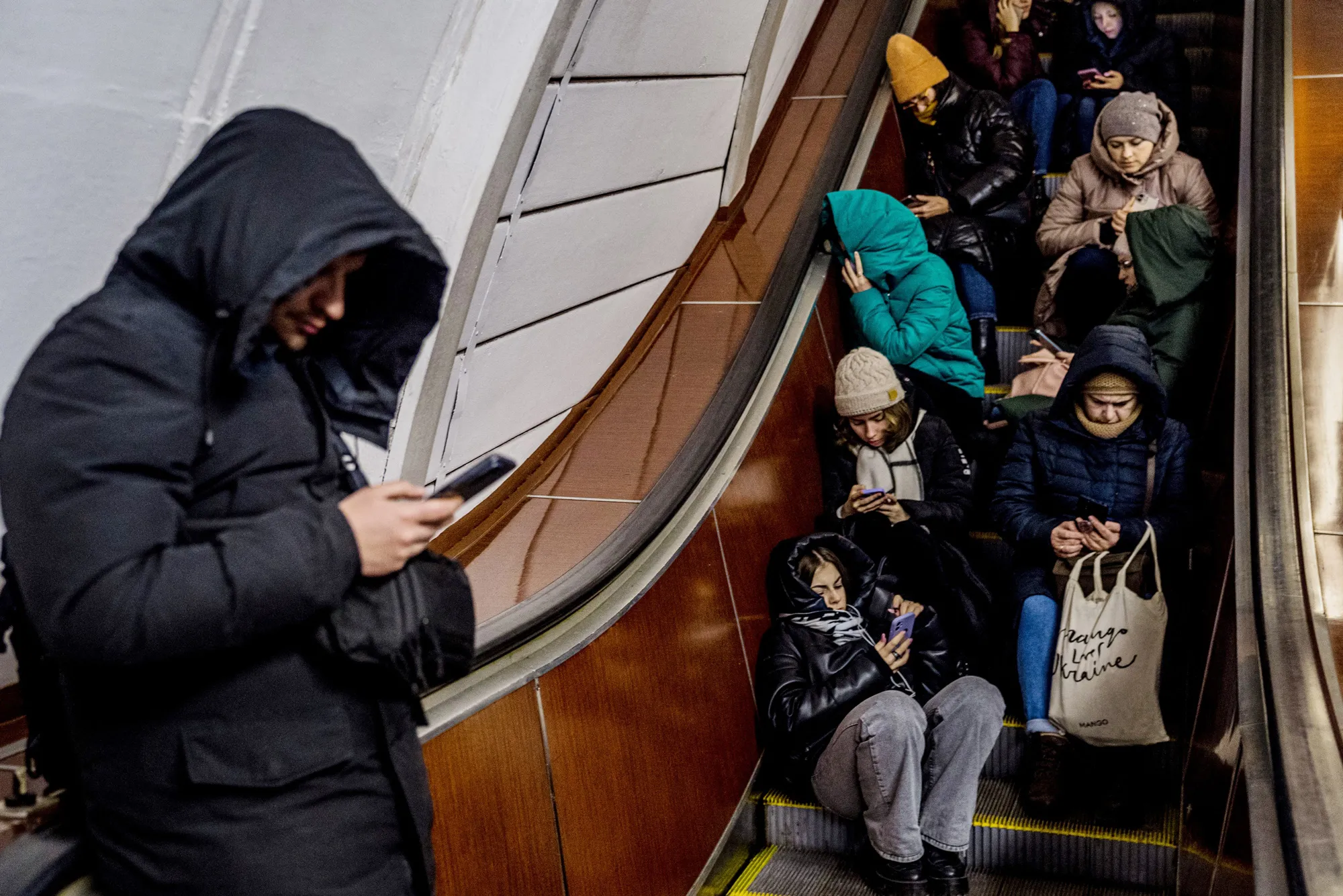 People shelter in a metro station during an air strike alarm in Kyiv on Feb. 10.