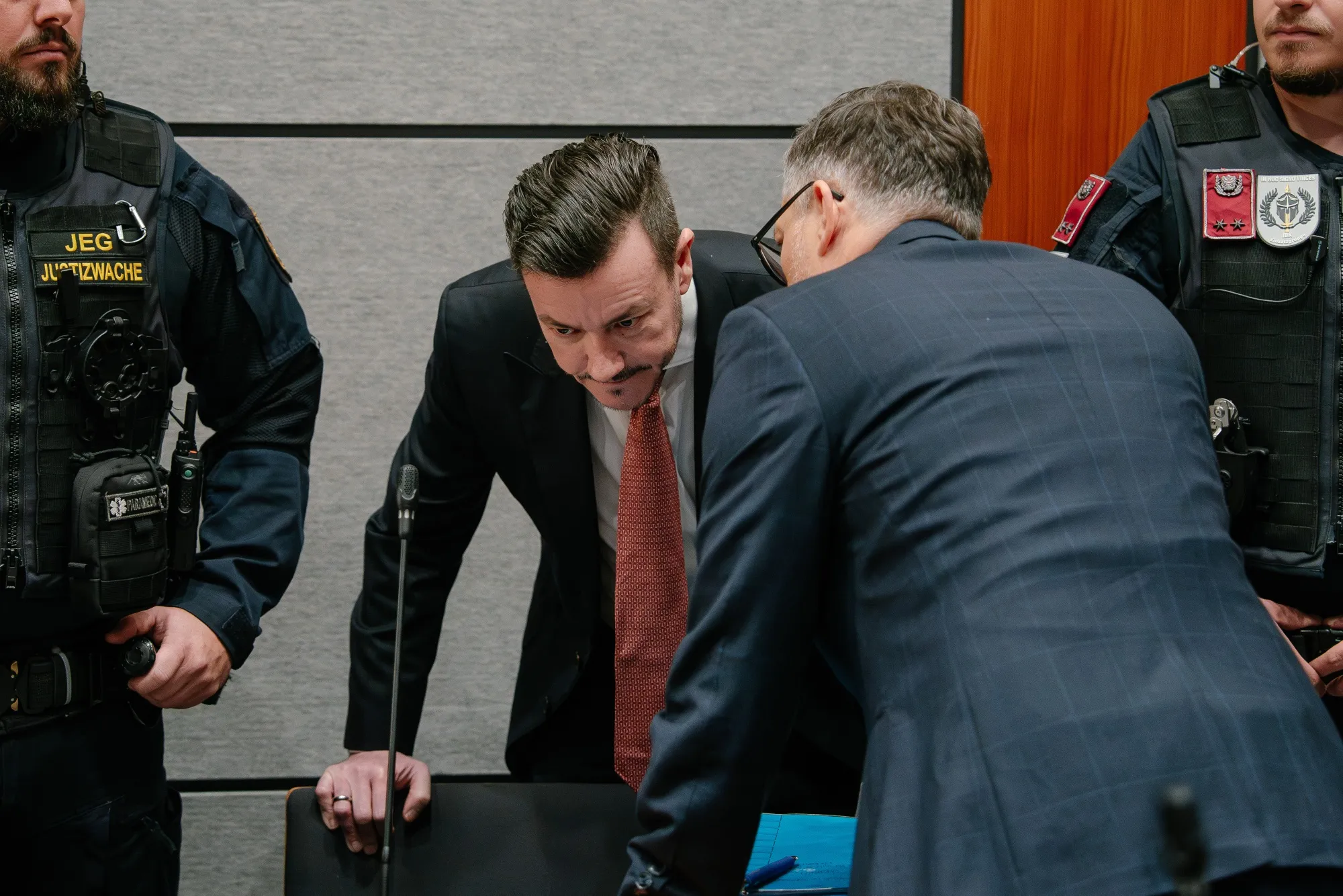 Rene Benko, center,&nbsp;speaks with his lawyer in court in Innsbruck,&nbsp;Austria, on Oct. 14.