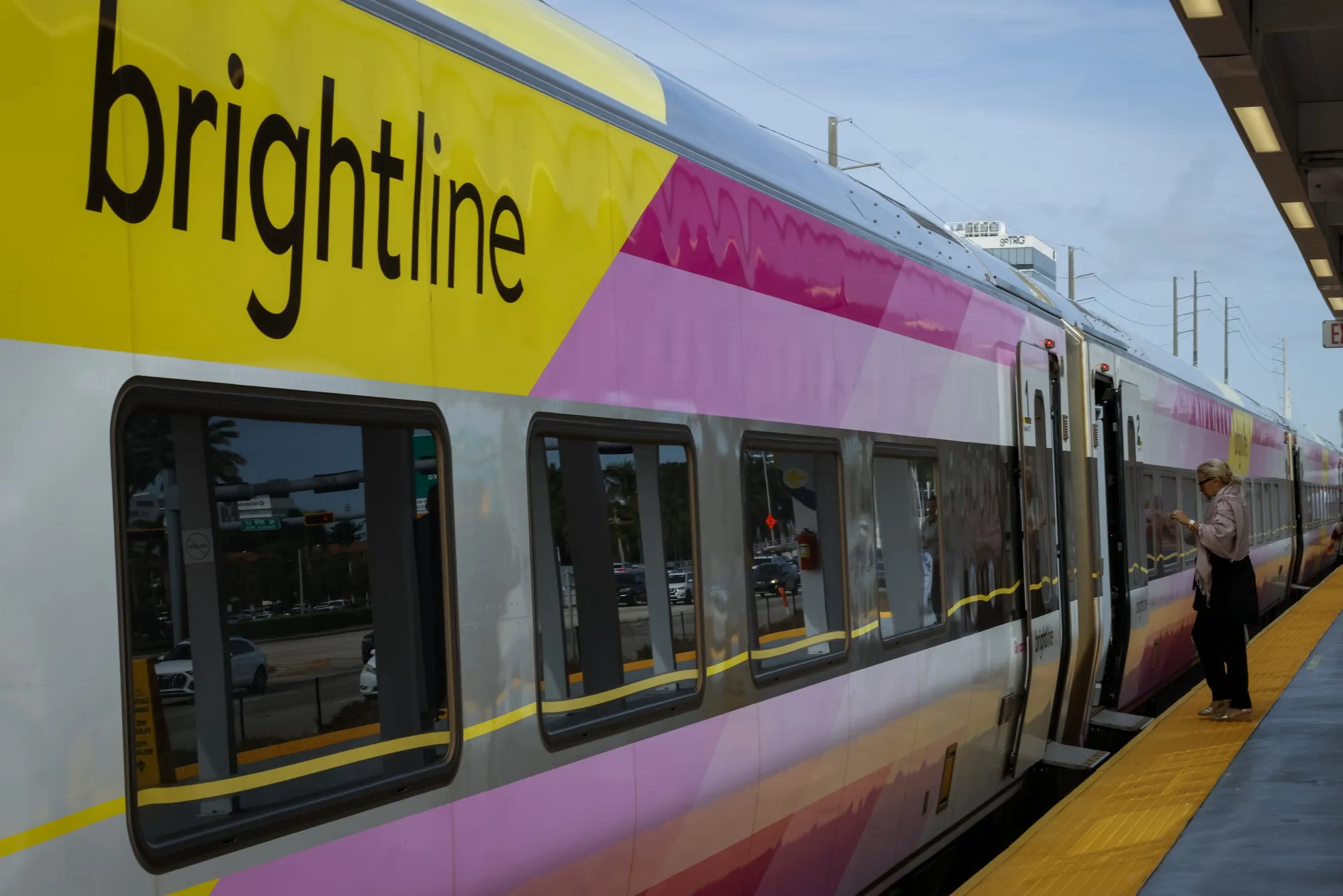 A passenger boards a Brightline train in Aventura, Florida.