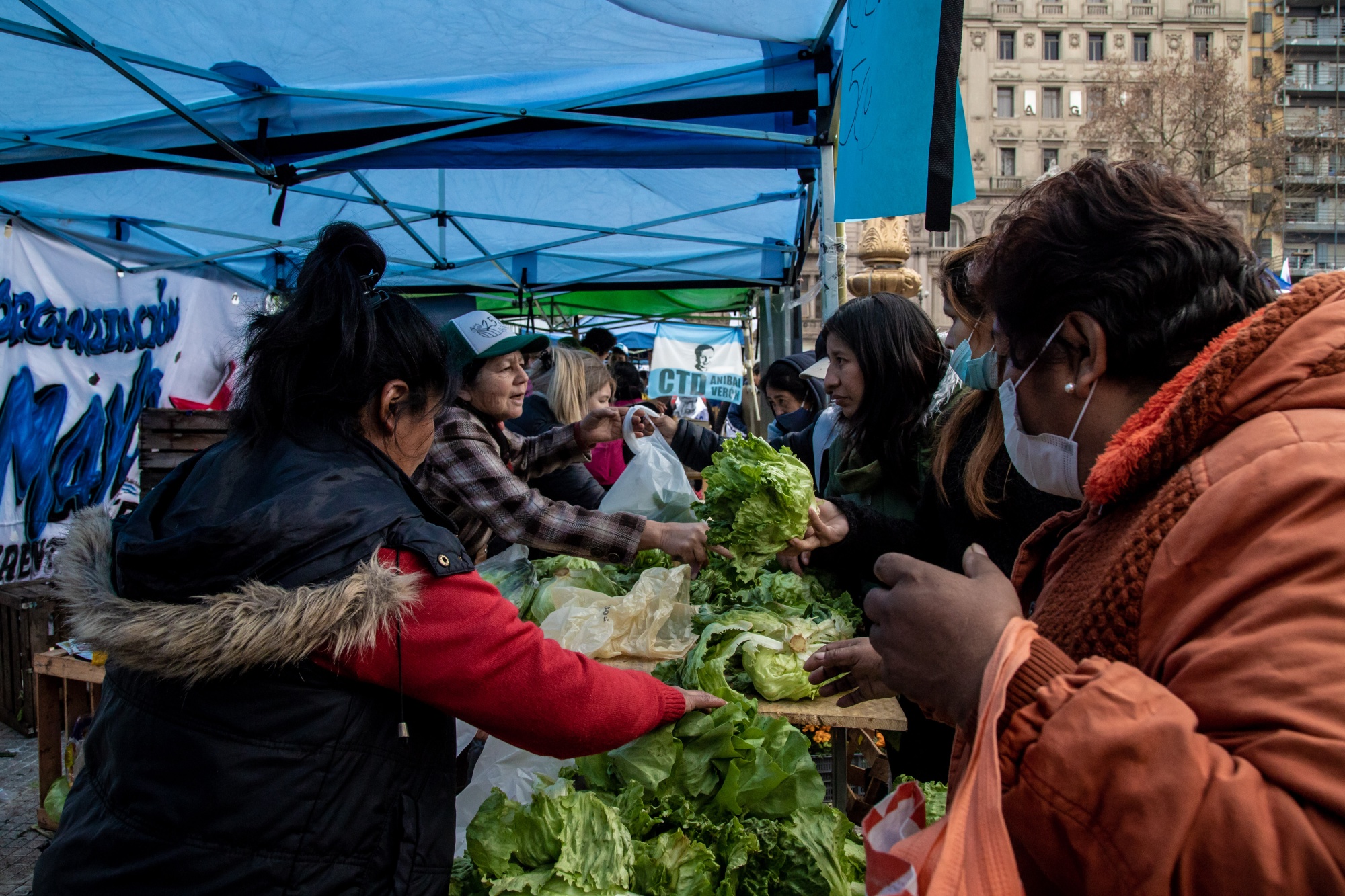 Shoppers purchase groceries at a market hosted by the Union of Popular Economic Workers to help those in need,&nbsp;in front of the National Congress building in Buenos Aires&nbsp;on&nbsp;July 14.