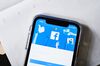 The Facebook Inc. website is displayed on an Apple Inc. iPhone.