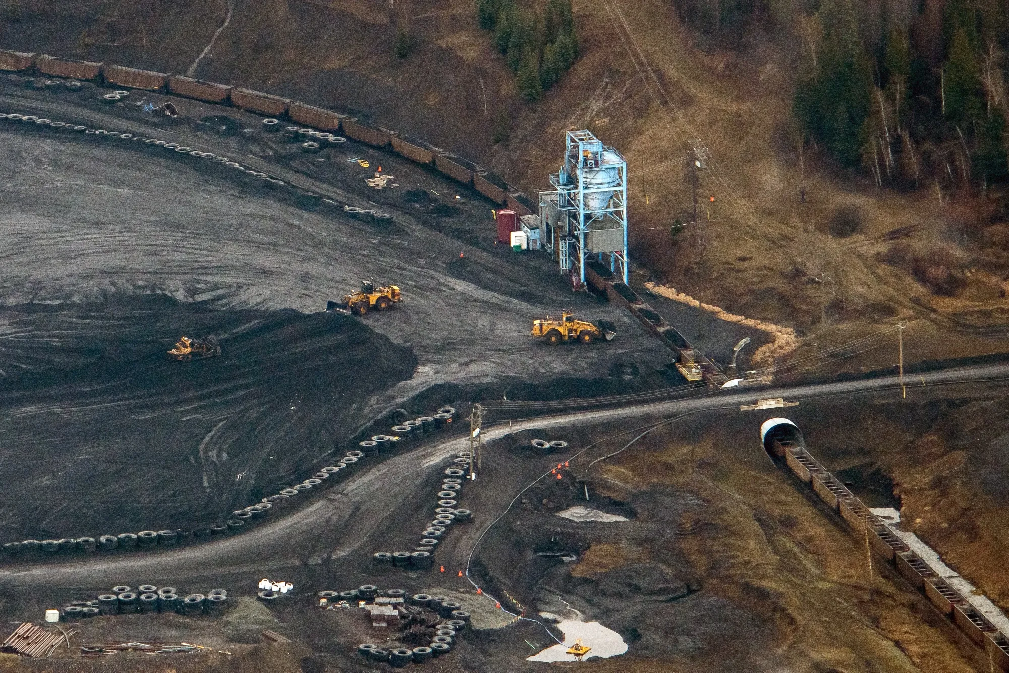 Train cars are loaded with coal at a Teck coal mine  near Sparwood, British Columbia, Canada.