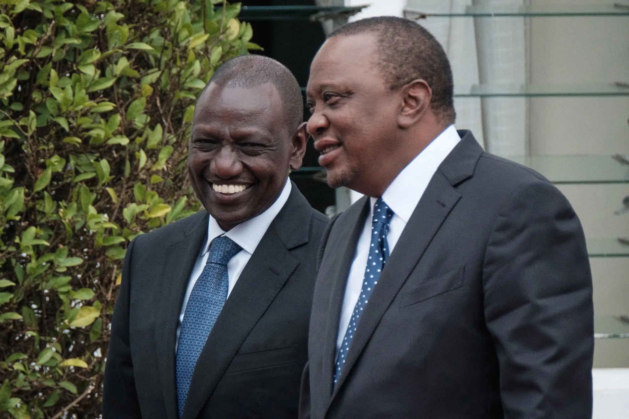 Kenya's President Uhuru Kenyatta (R) and Deputy President William Ruto.