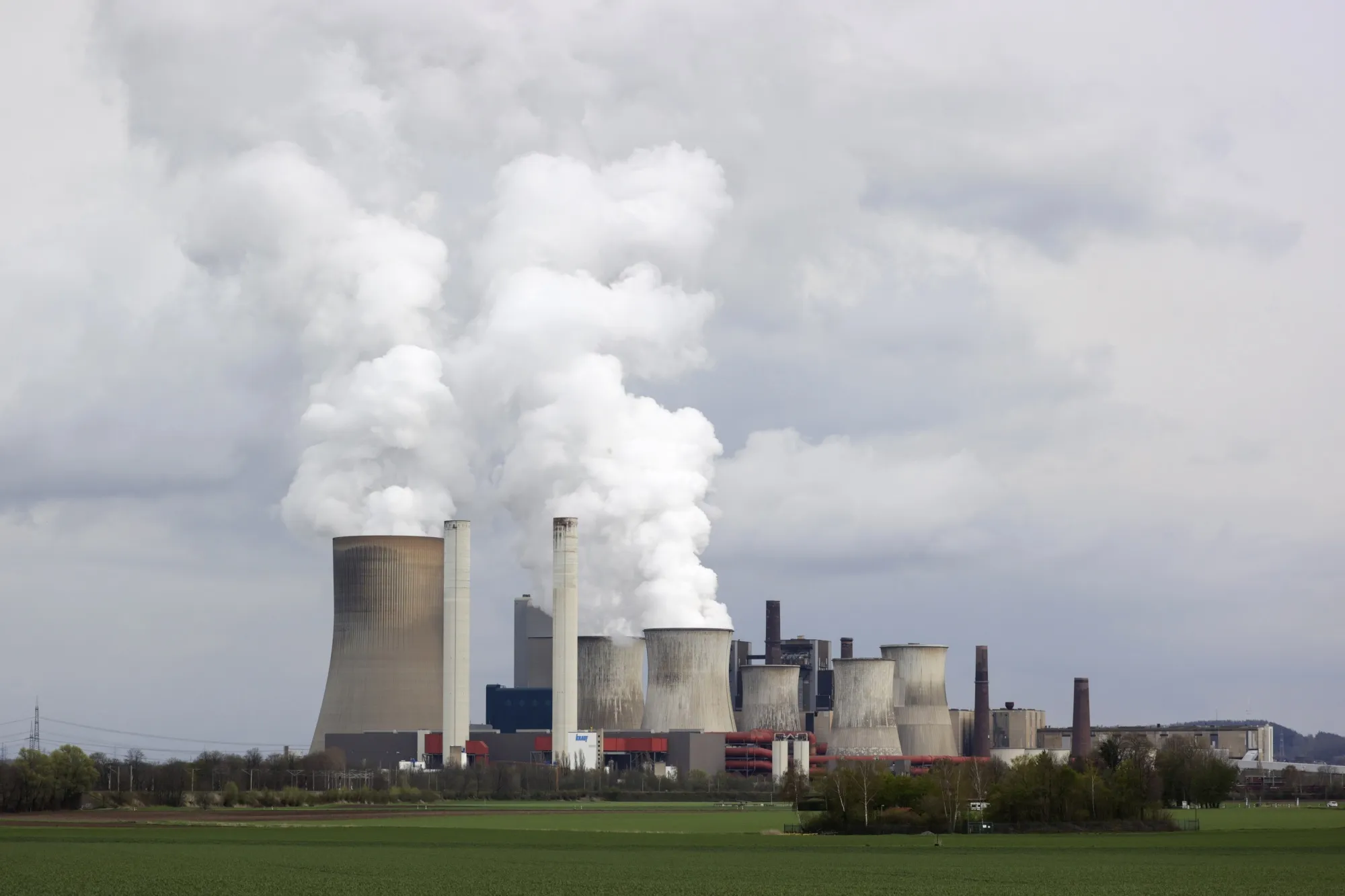 Cooling towers emit vapor at a lignite fueled power station in Bergheim Niederaussem, Germany.