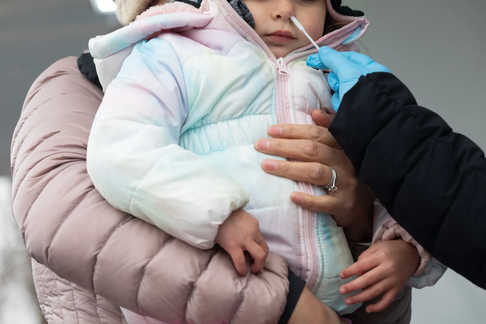 A child receives a Covid-19 test at a Philadelphia Department of Public Health mobile testing site.