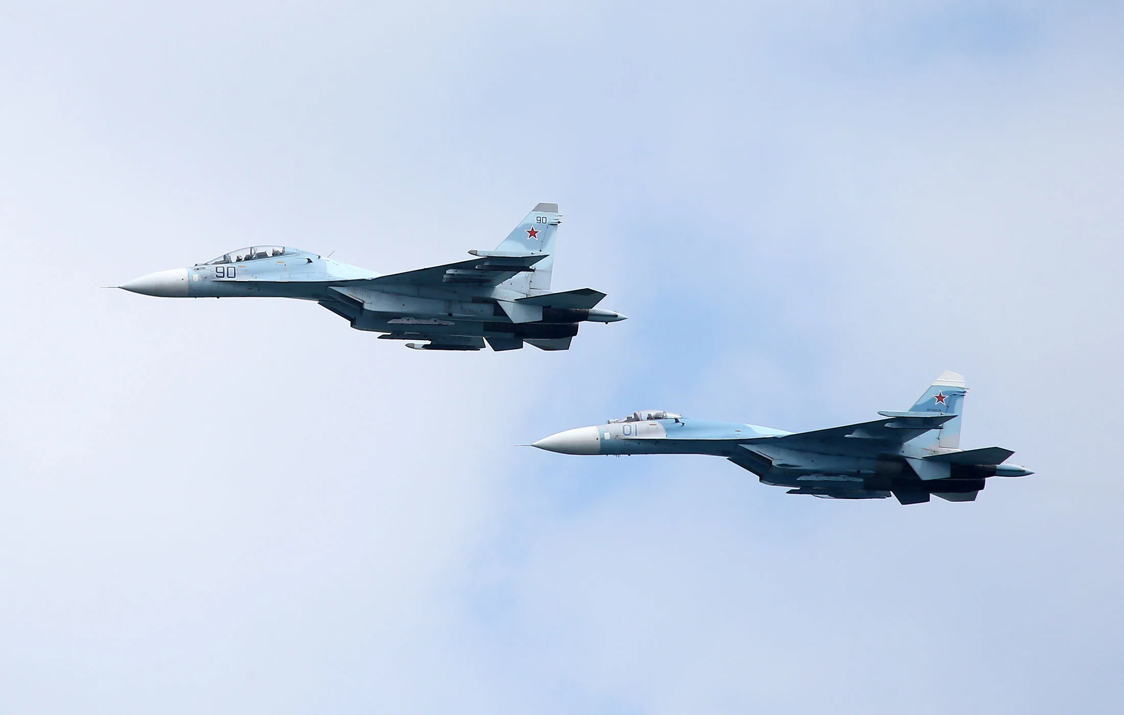 Sukhoi Su-30SM fighter jets fly during a Victory Day air show.