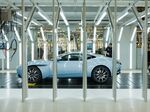An Aston Martin DB11 automobile sits in the final inspection area at the Aston Martin Lagonda Ltd. manufacturing and assembly plant in Gaydon, U.K.