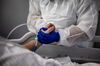 A nurse washes a Covid-19 patient at a hospital in Pierre-Benite, France, on Jan. 25. 