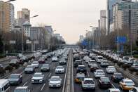 Commuters in Beijing As Xi's Consumer Boom Thwarted by Secret Trades, Debt Misuse