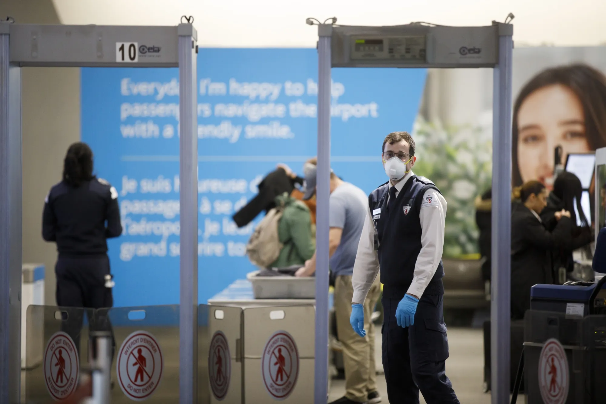 A security agent at Pearson airport in Toronto on March 16.