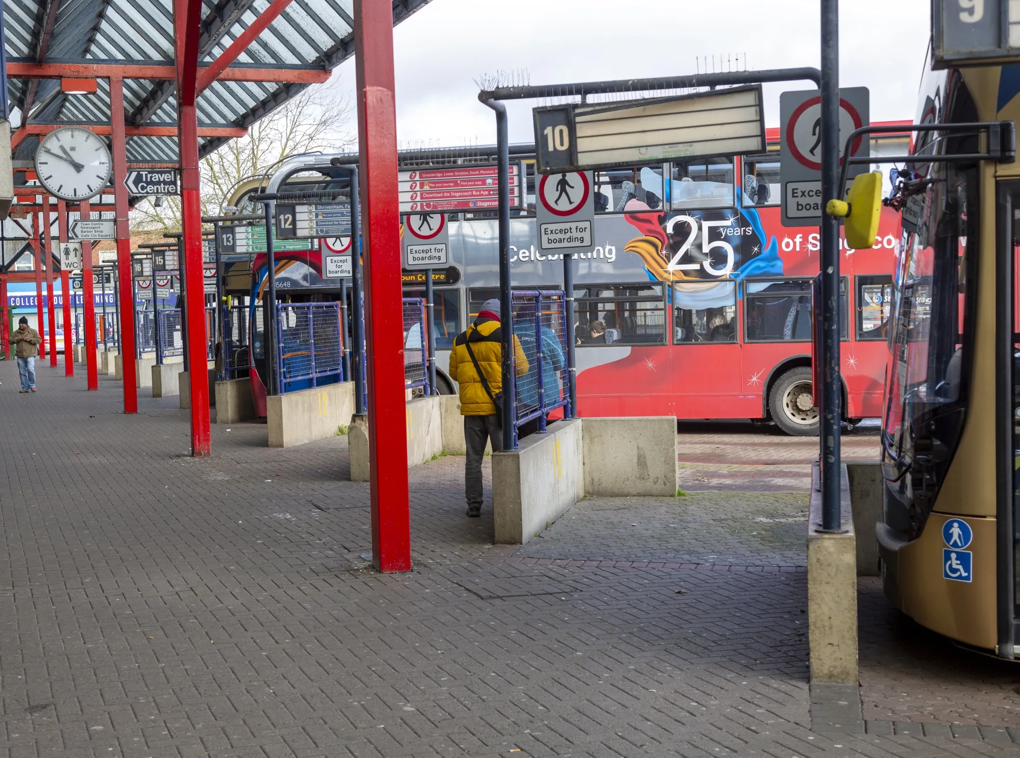 Buses at bus station in the town center of Swindon, UK.