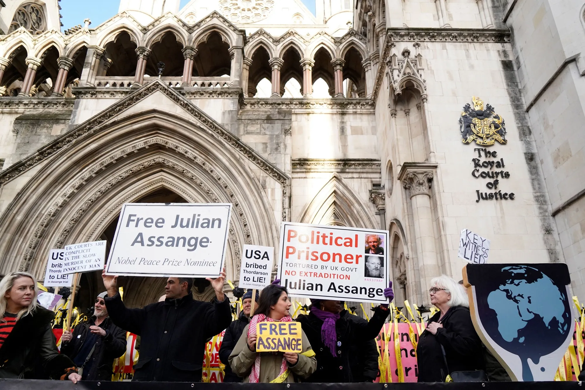 Supporters of Julian Assange outside the Royal Courts of Justice in London on Dec. 10. 
