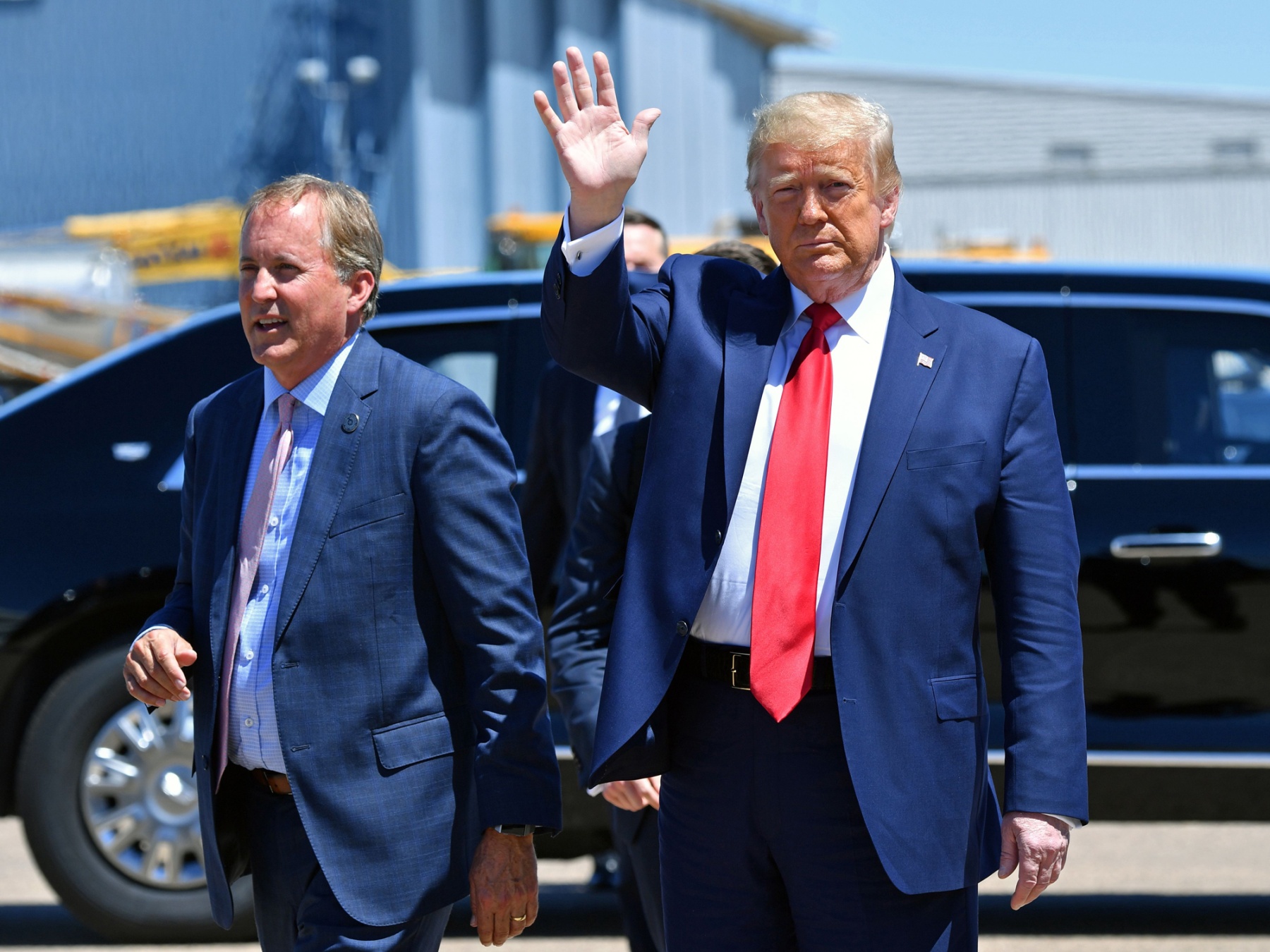 U.S. President Donald Trump, right, and Ken Paxton in Dallas in June.