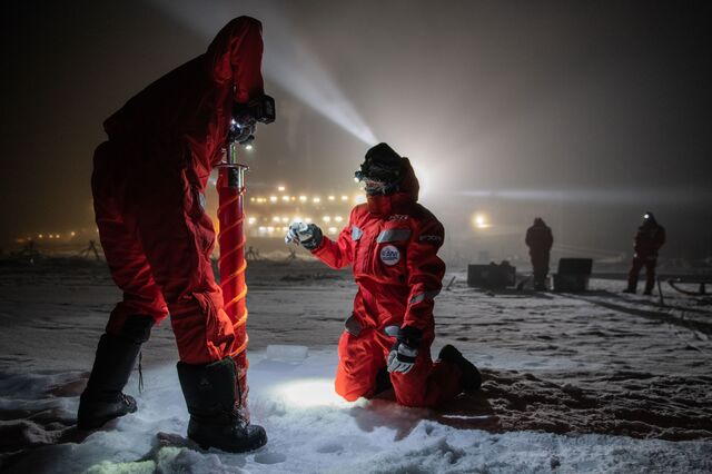 Crew members from the Polarstern expedition collect ice cores on Dec. 15, 2019. 