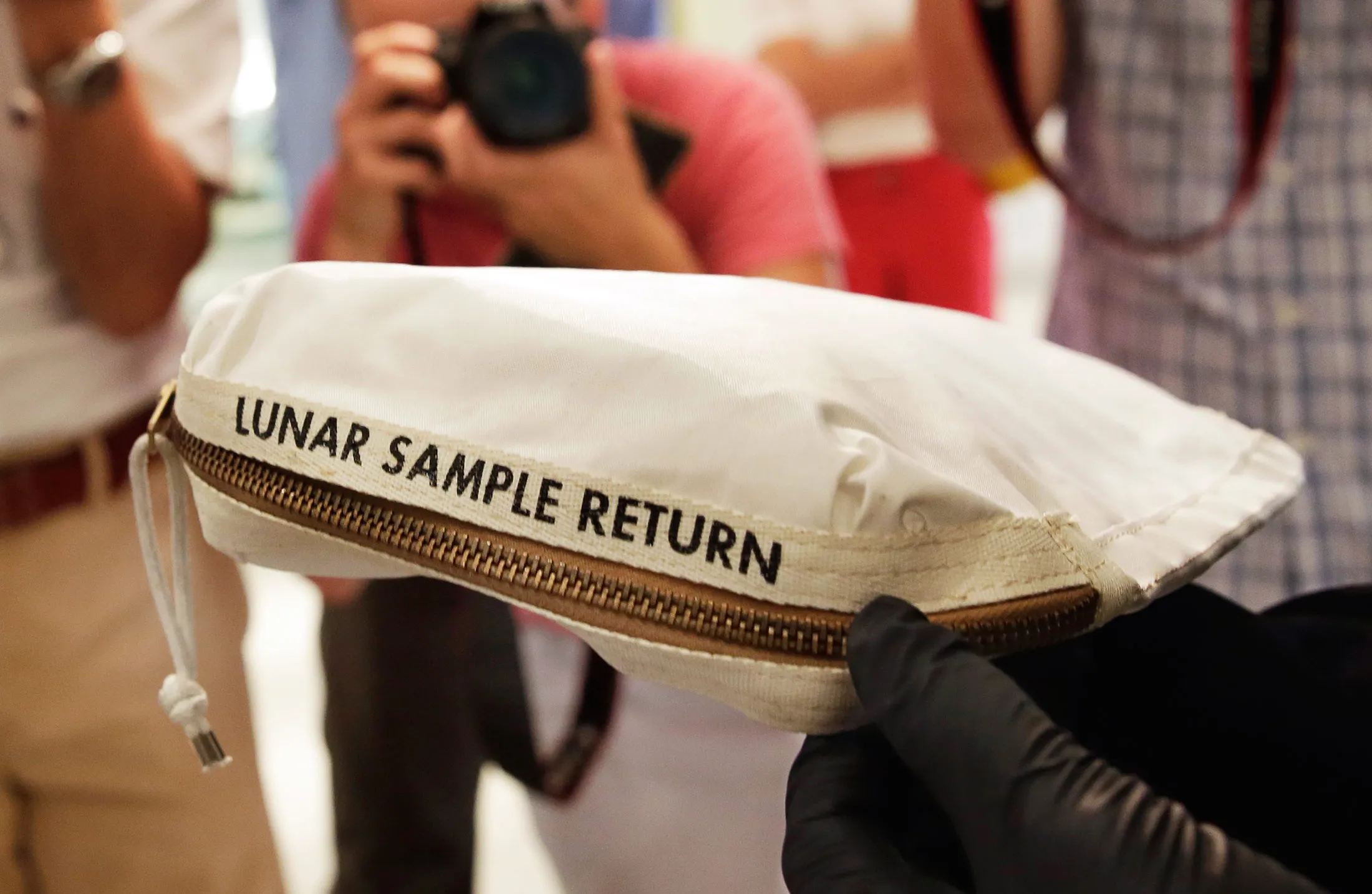 Apollo 11 Bag Laced With Moon Dust Sells for $1.8 Million - Bloomberg