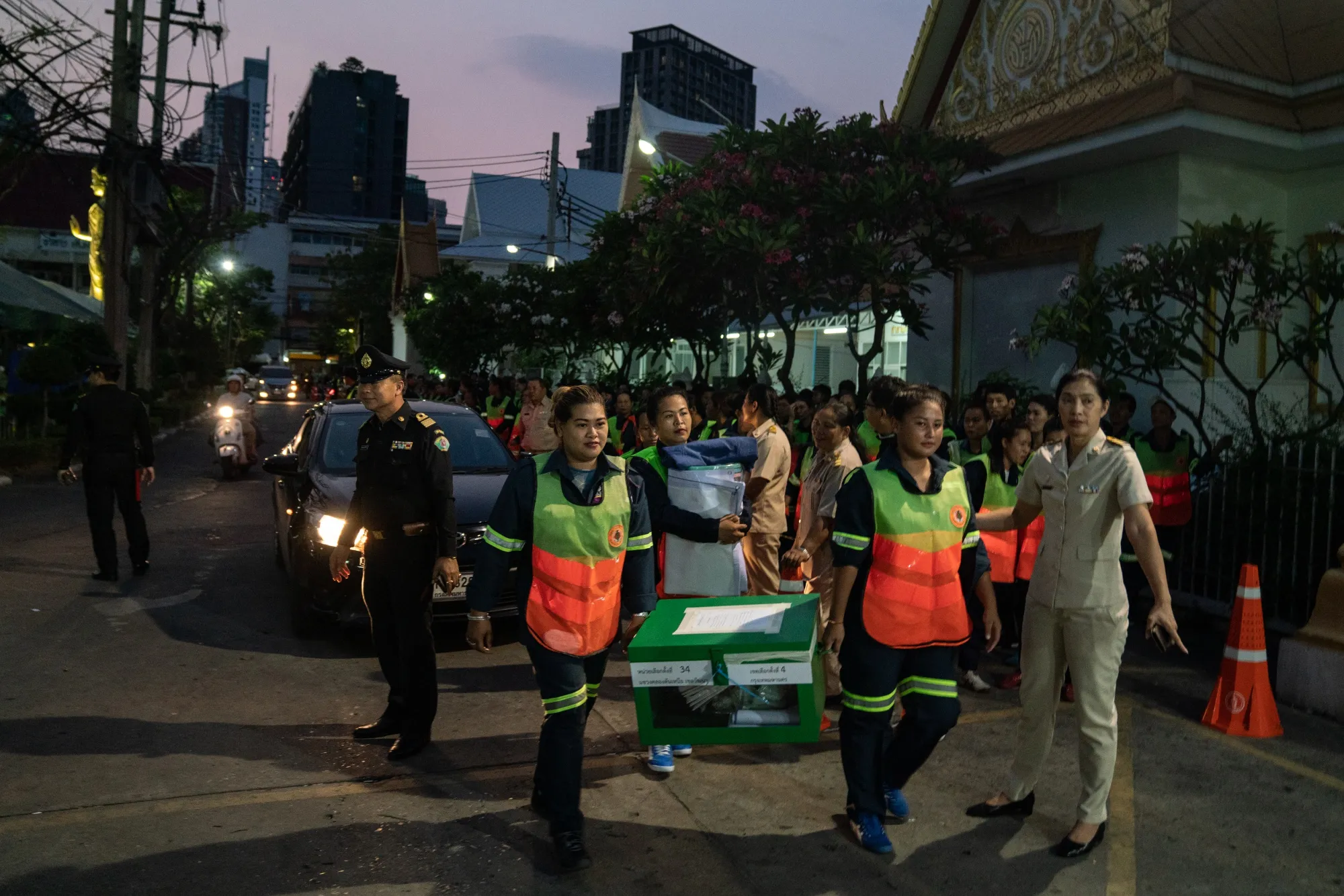 Officials transport ballot boxes to the district office during a general election in Bangkok, March 24.