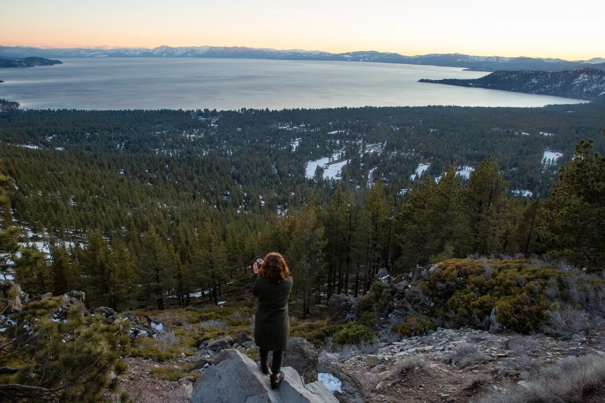 A visitor takes a photo of Lake Tahoe at the top of Mount Rose highway in Incline Village, Nevada.