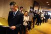 Unemployed Americans line up as they wai