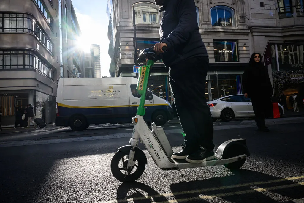 &nbsp;A man rides a rented "Lime" e-scooter&nbsp;in London,&nbsp;