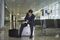 A businessman waiting in the departure lounge.