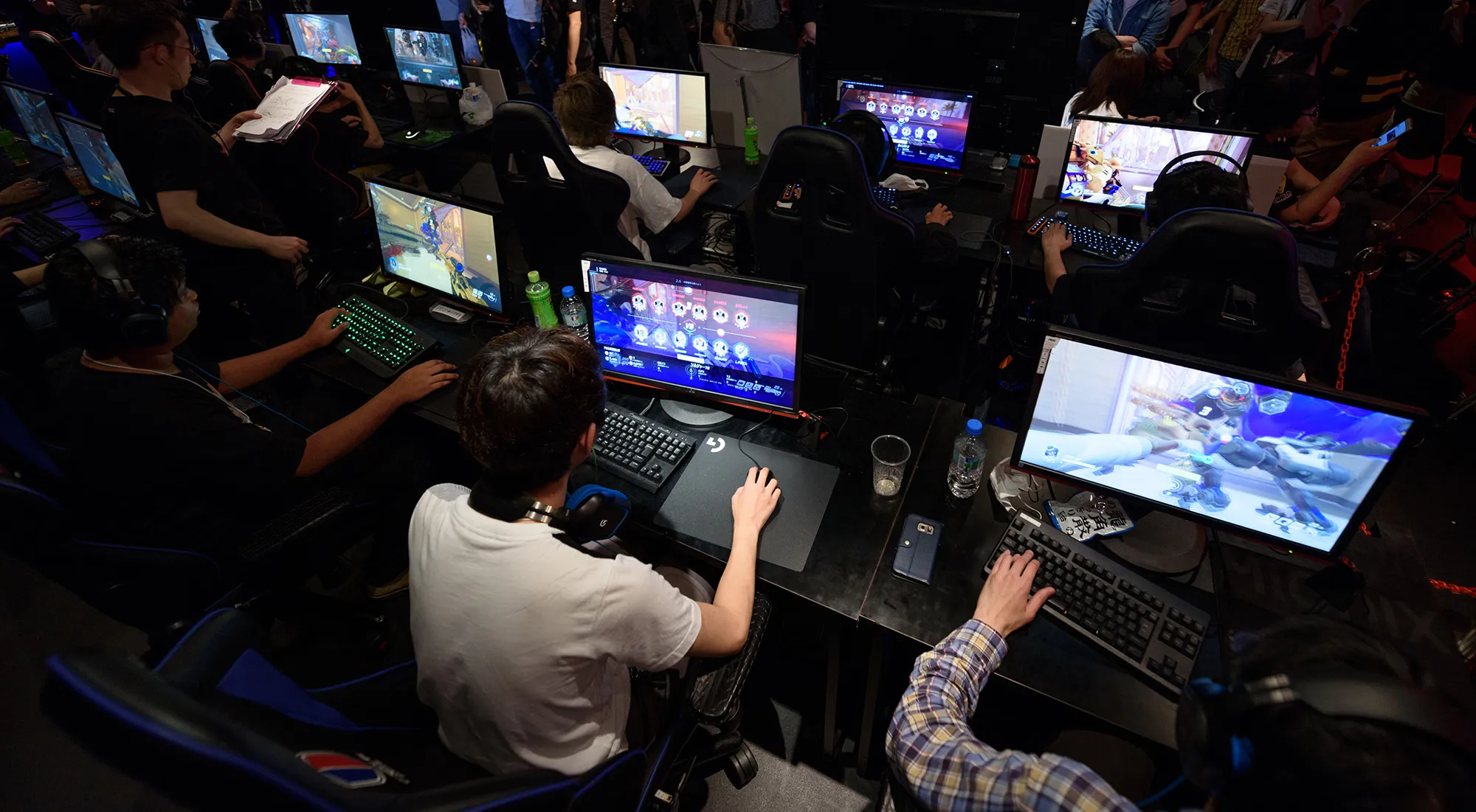 Attendees play Activision Blizzard Inc.'s Overwatch computer game at the AOC Open e-Sports event in Tokyo.