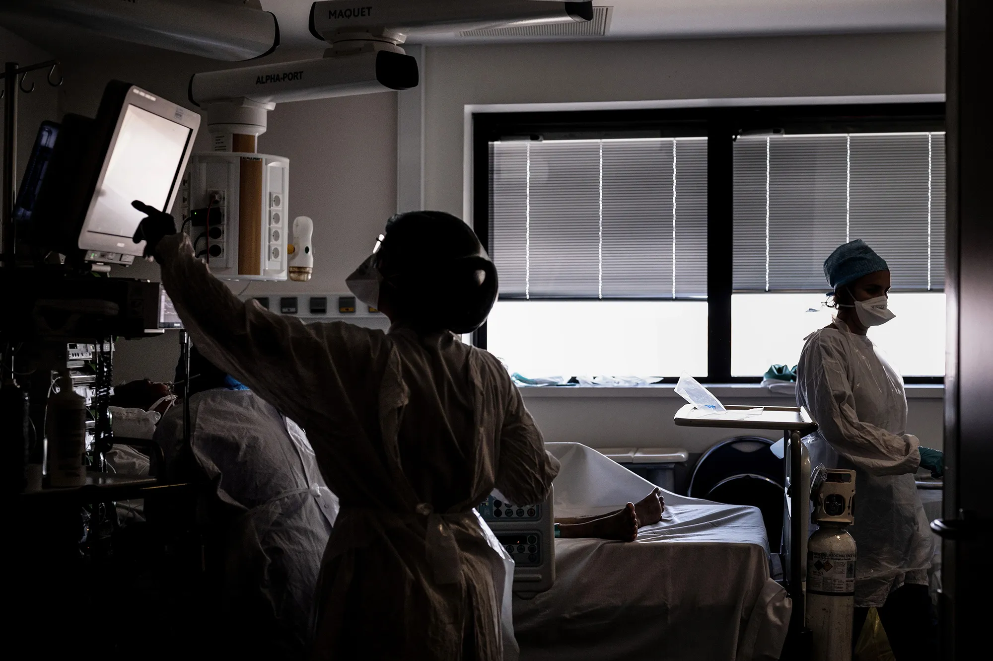 Medical staff care for a Covid-19 patient at the Croix-Rousse hospital in Lyon, France. The number of hospitalizations in France has started to climb.