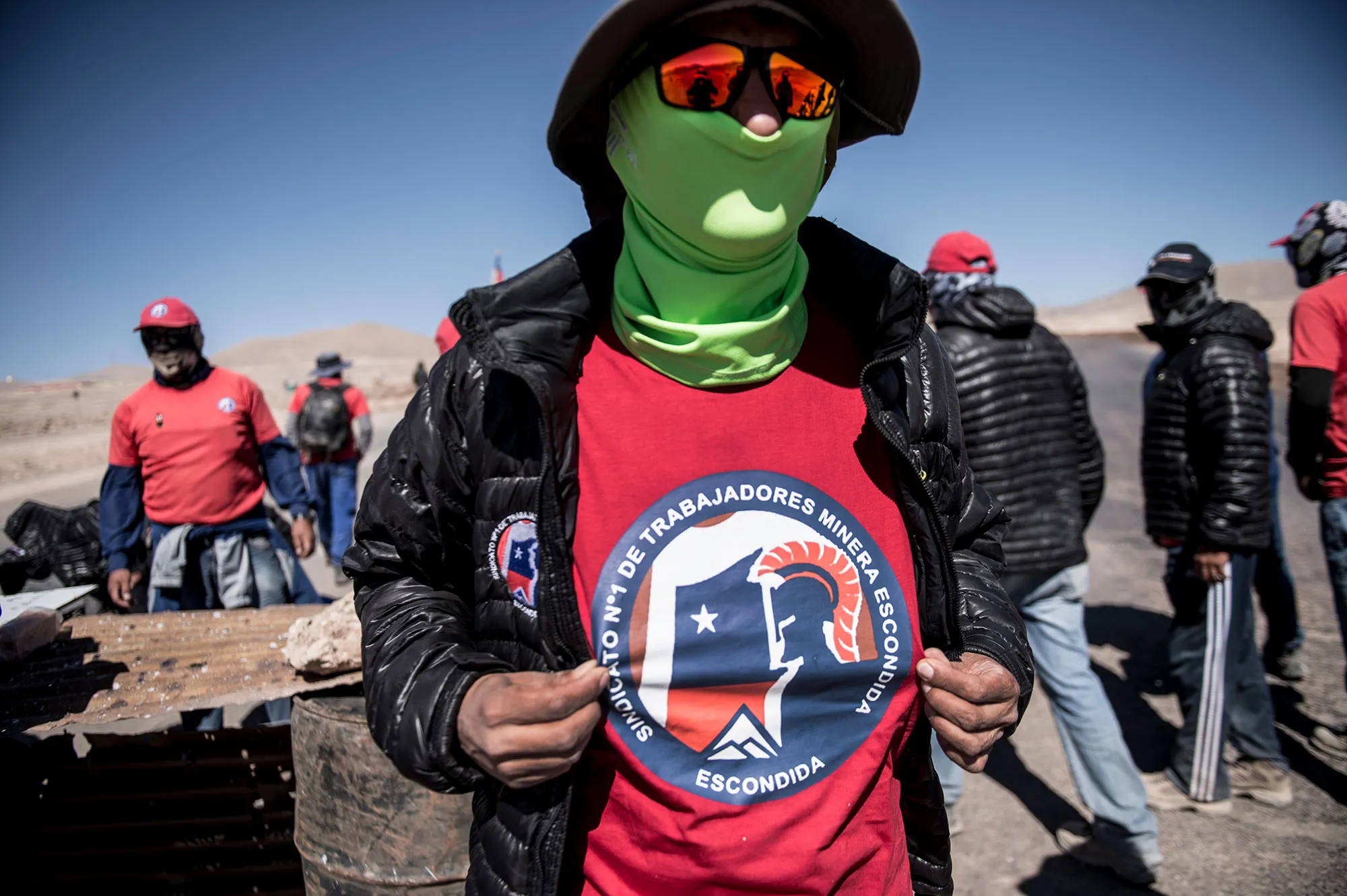 Workers gather outside the Escondida copper mine during a strike, near Antofagasta, Chile, on March 8.
